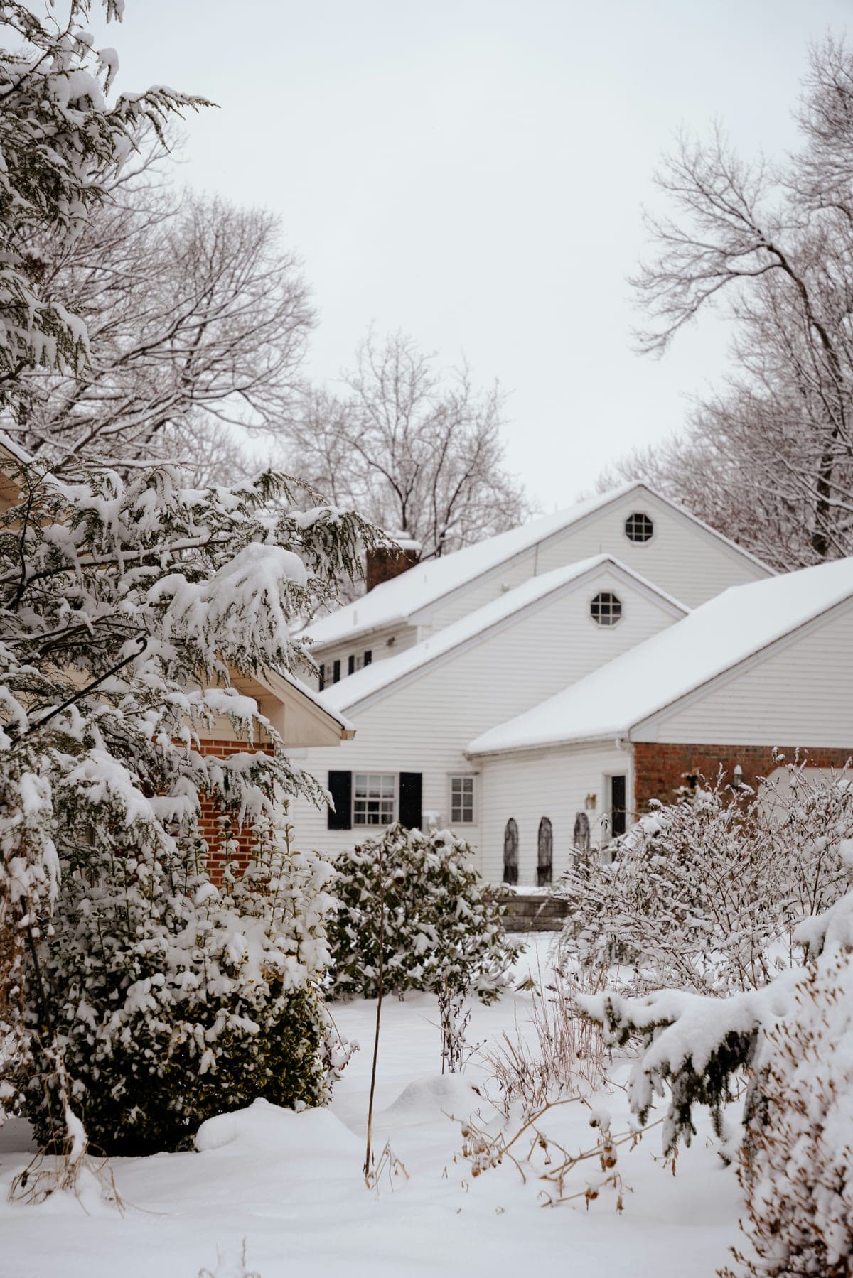Snow-covered home after a winter storm, the kind of weather that takes lines down